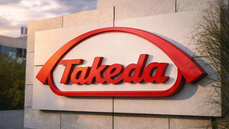 Takeda logo mounted on exterior wall of corporate building