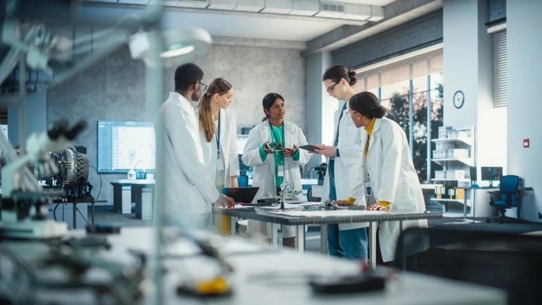 Scientists reviewing peptide research data in pharmaceutical lab