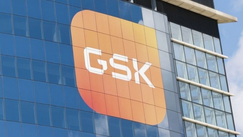 GSK corporate logo on modern glass office building exterior